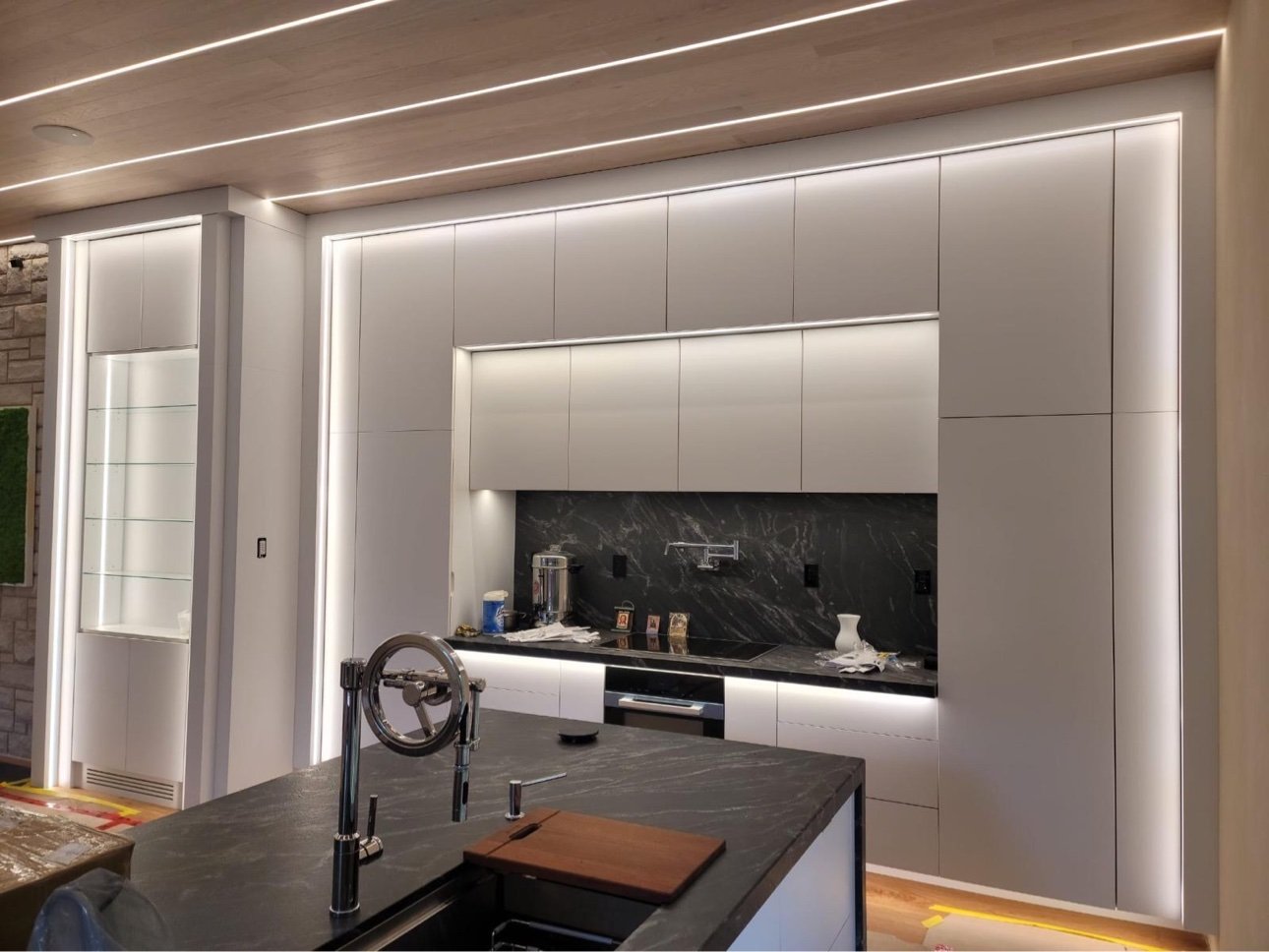 Handleless white kitchen with integrated LED lighting