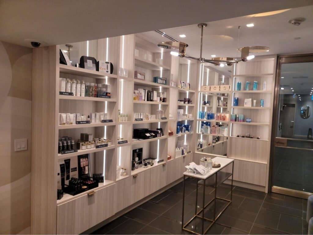Illuminated custom retail shelving for a salon and spa by T.H. Cabinets
