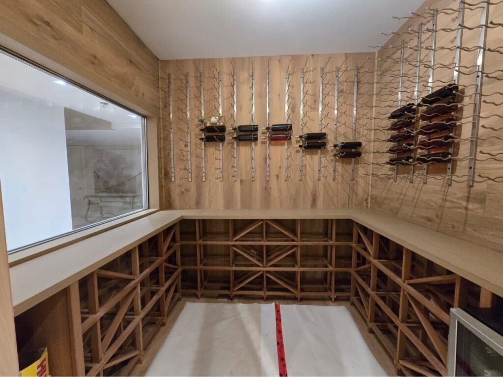 Oak wine cellar with diamond-bin racking by T.H. Cabinets