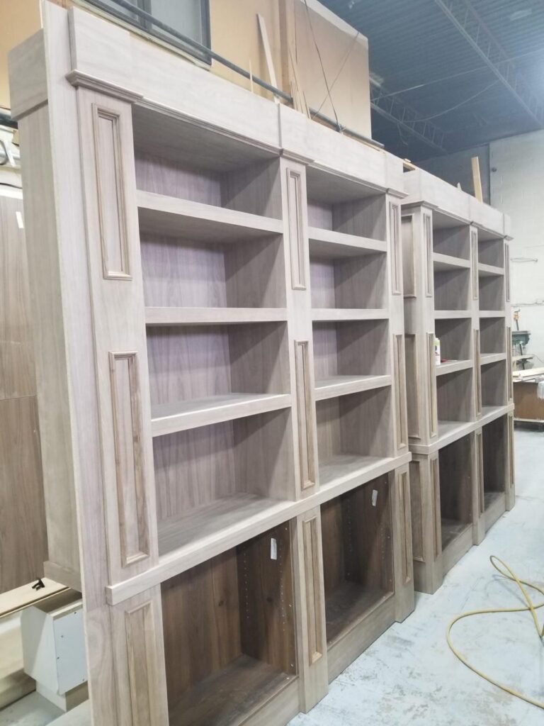 Custom bookcase units assembled in the T.H. Cabinets workshop