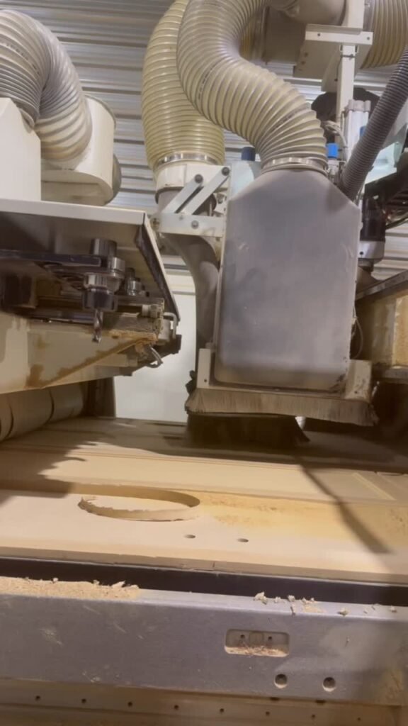 CNC spindle profiling a door panel, T.H. Cabinets workshop